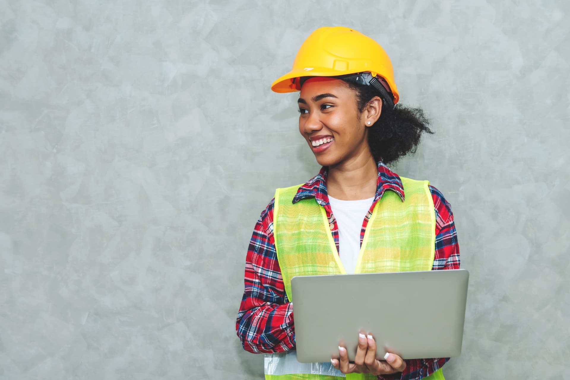 A graduate architect working on a laptop
